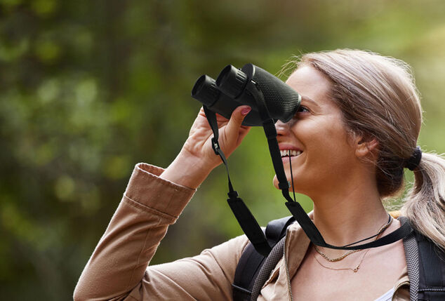 Compact binoculars including carrying bag